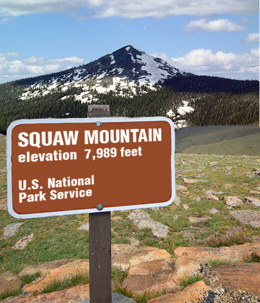 A sign in front of a mountain

Description automatically generated